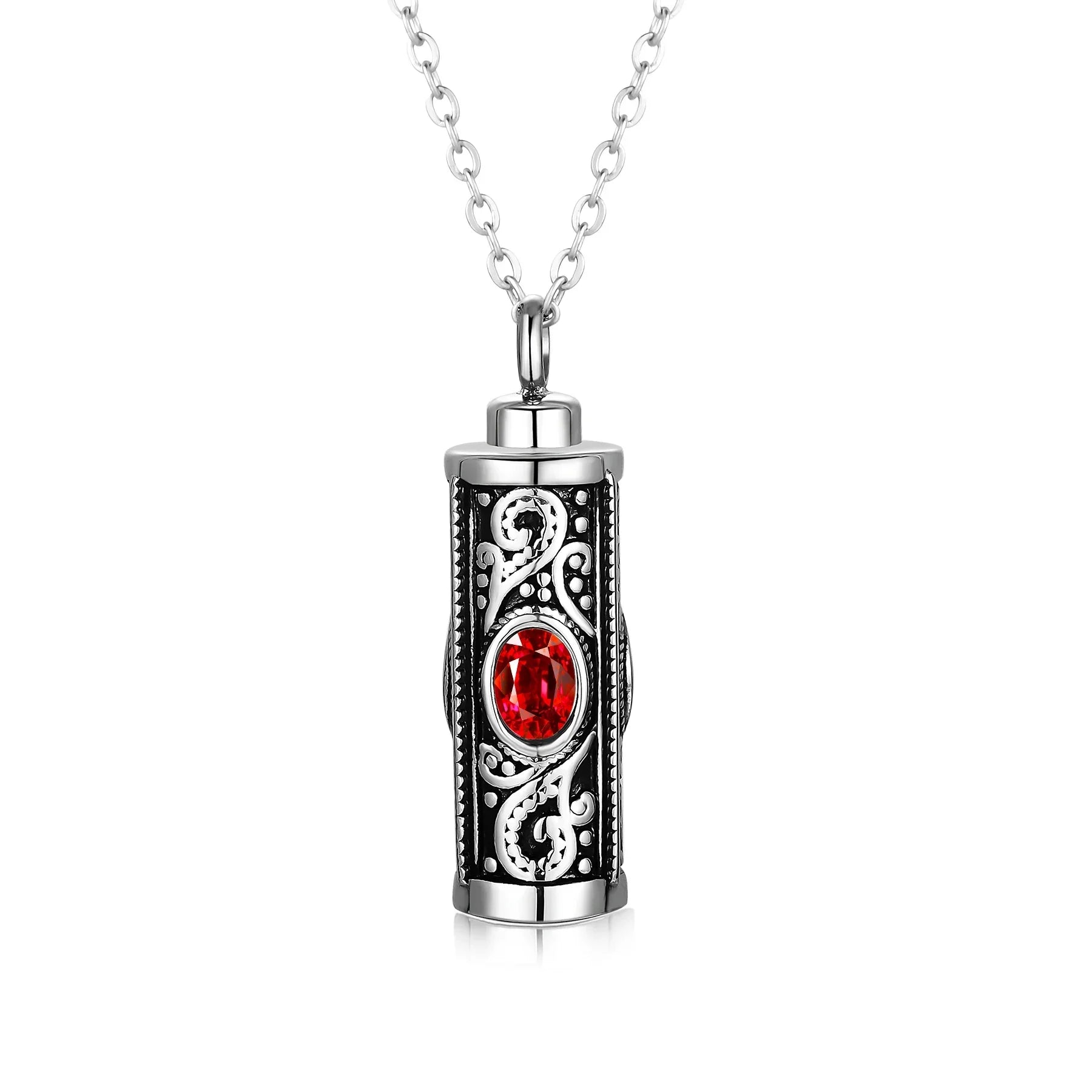 Silver pendant necklace with red gemstone and intricate scrollwork design