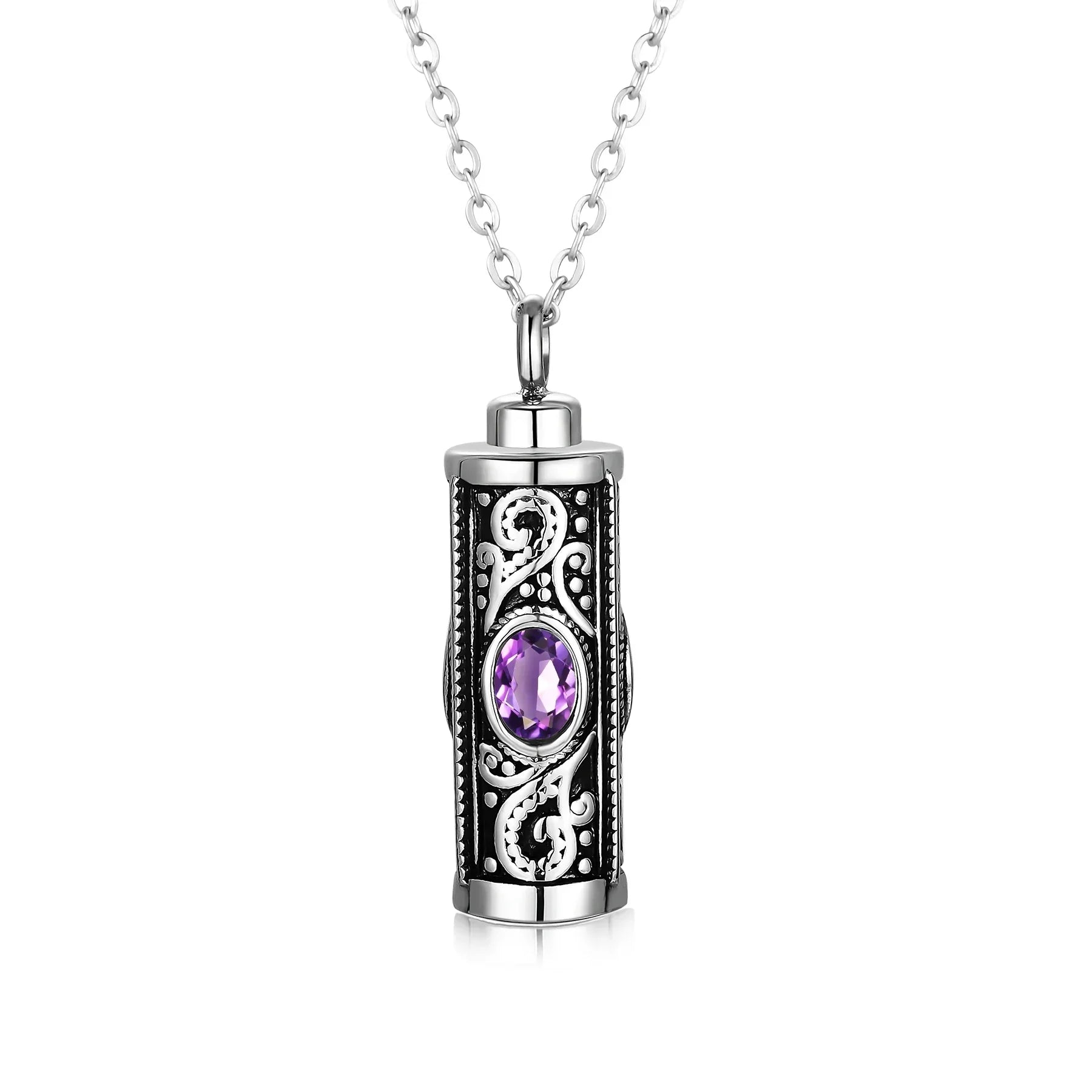 Silver pendant necklace with ornate design and purple gemstone center